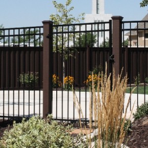 Trex Fence posts with ornamental iron gate