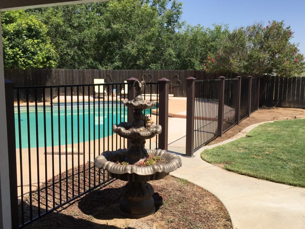 Trex Fence Posts with Ornamental Panels Around Pool