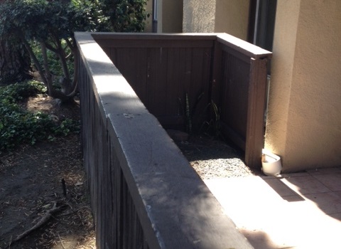 Old wood fence before replacement with Trex