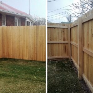Stockade style wood fence with 2x4 back rails