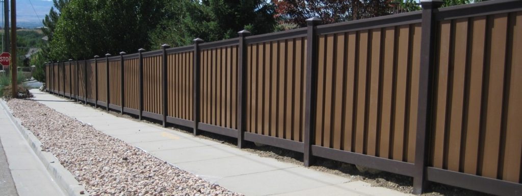Trex Fencing with dark brown posts and rails and tan pickets